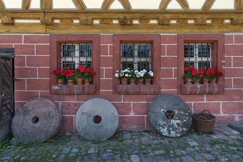 Old millstones in front of the flour mill