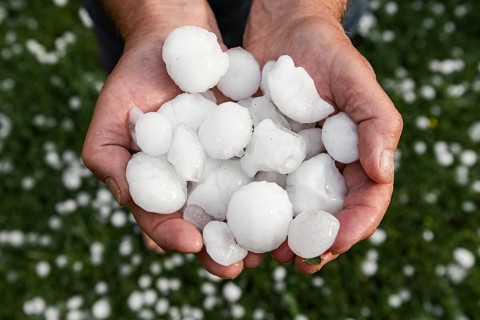 Golfball-sized hailstones in hands