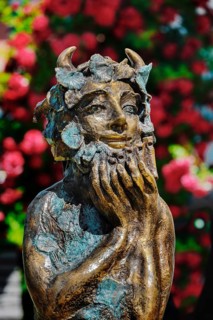 Figure of Pan with wild roses