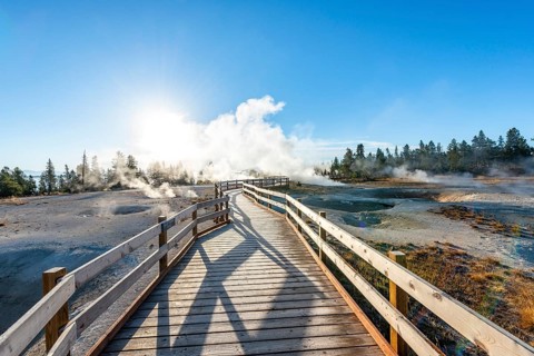 Boardwalk between steaming hot springs