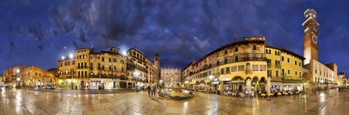360 panorama of the city square Piazza delle Erbe and former Roman Forum with fountain Fontana Madonna Verona and the medieval tower Torre dei Lamberti in the evening