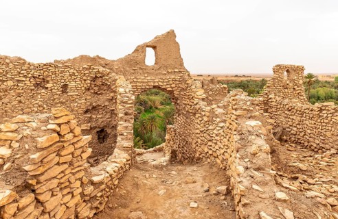 Ruins of the ancient city at the oasis Source Bleu