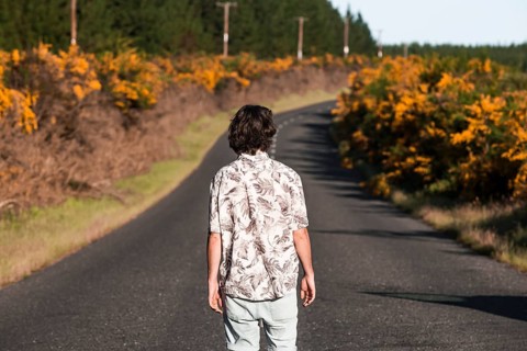 Guy walking on a road
