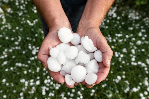 Golfball-sized hailstones in hands
