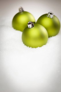 Beautiful matt green christmas ornaments on snow flakes room for your own text