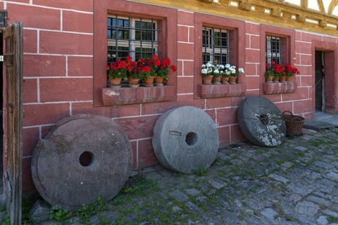 Old millstones in front of the flour mill