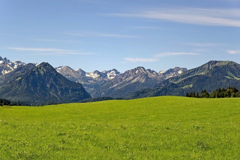 View from the meadows near the village Reichenbach to the mountain panorama of the Allgaeu Alps