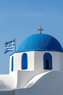 Blue and White Greek Orthodox Church Agios Nikolaos with Greek Flag