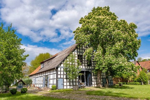 Half-timbered house in the round village Satemin