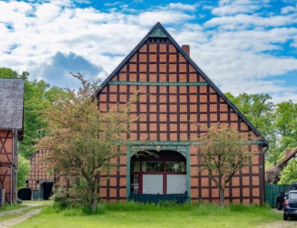 Half-timbered house in the round village of Satemin