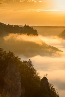 View from Eichfelsen to Werenwag Castle with morning fog