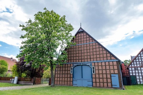 Half-timbered house in the round village of Satemin