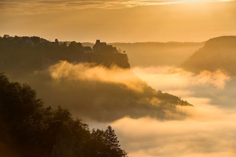 View from Eichfelsen to Werenwag Castle with morning fog