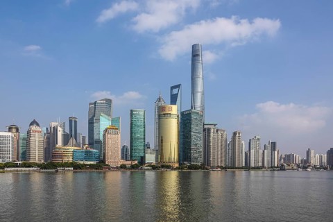 View over the Huangpu River to the skyline of the special economic zone Pudong with the skyscrapers Jin MaoTower