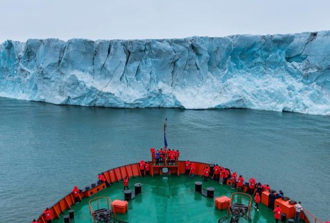 Icebreaker apporaching a massive glacier on Mc Clintok or Klintok Island