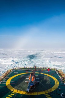 Fog bow or white rainbow in the ice around the North Pole