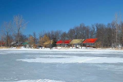 Colourful cottages along the frozen Saint Lawrence River