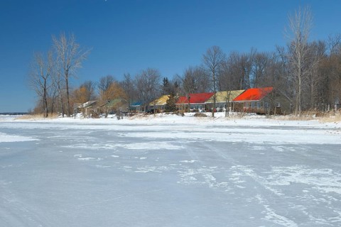 Colourful cottages along the frozen Saint Lawrence River