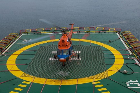 Helicopter landing on a helipad of an icebreaker
