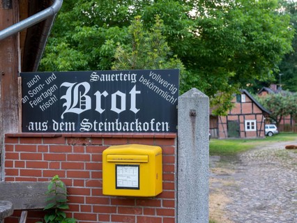 Letterbox and sign for selling bread in the Rundlingsdorf Luebeln