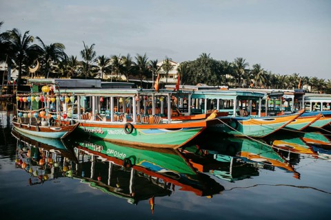Colorful tourist boats on the river in Hoi An