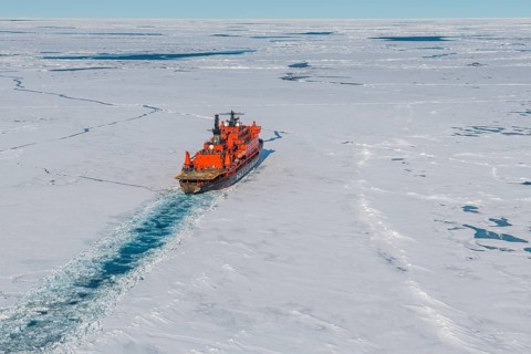 Aerial of the Icebreaker '50 years of victory' on its way to the North Pole breaking through the ice