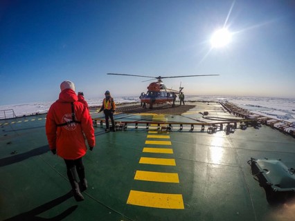 Helicopter on the Helipad of the Icebreaker '50 years of victory' on its way to the North Pole breaking through the ice