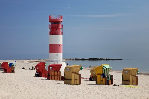 Lighthouse with beach chairs at the south beach of the island Duene