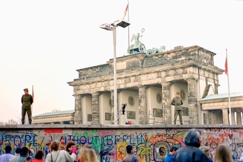 Wall in front of the Brandenburg Gate monitored by two People's Police officers and a camera
