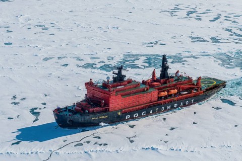 Aerial of the Icebreaker '50 years of victory' on its way to the North Pole breaking through the ice