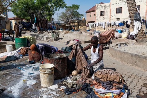 Man washing at the public wash area