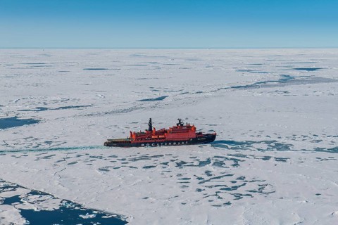 Aerial of the Icebreaker '50 years of victory' on its way to the North Pole breaking through the ice