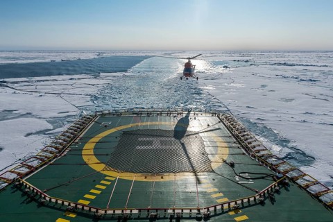 Helicopter on the Helipad of the Icebreaker '50 years of victory' on its way to the North Pole breaking through the ice
