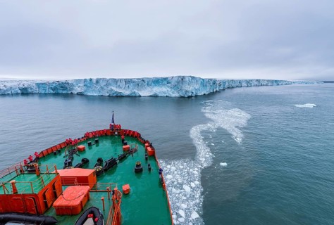 Icebreaker apporaching a massive glacier on Mc Clintok or Klintok Island