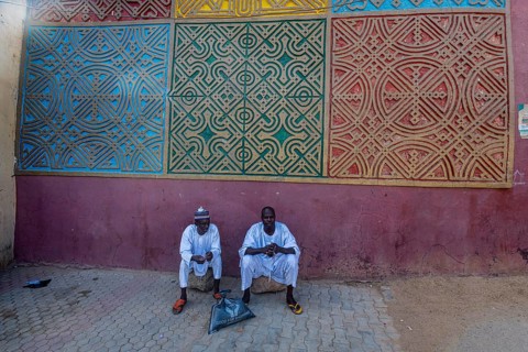Men sitting at the entrance to Gidan Rumfa