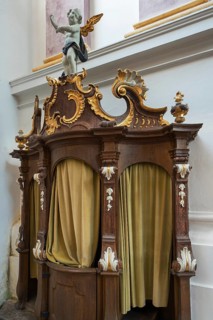 Confessional with carvings
