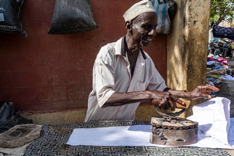 Many ironing with very old iron