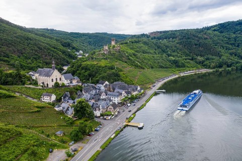 Cruise ship passing Beilstein on the Moselle with Metternich castle