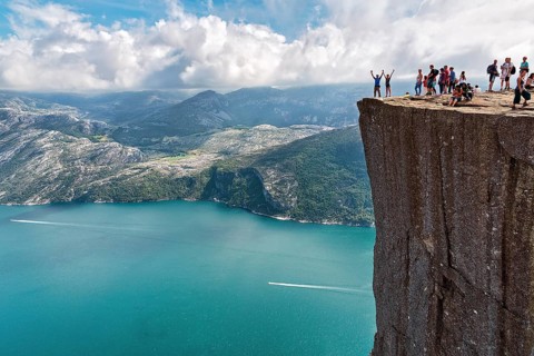 Hiker on rocky peak Preikestolen