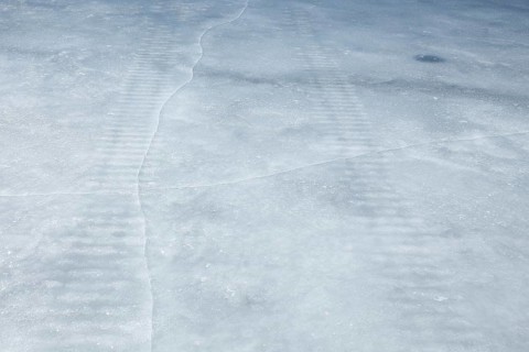 Frozen snowmobile prints