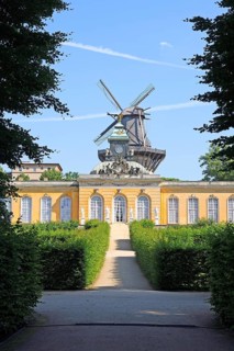 View of the dome of the new chambers with historic windmill behind it