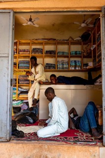 Boys hanging out in a shop in the bazaar