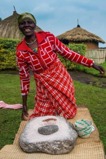 Woman preparing local bread at a ceremony of former poachers
