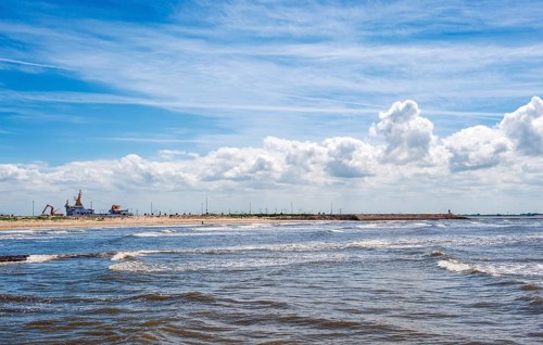 Sandy beach beach at the pier of the ferry line Nessmersiel-Baltrum
