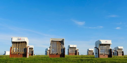 Empty beach chairs at the green beach