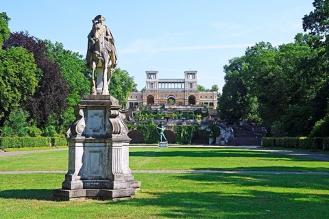 Equestrian statue of Frederick II and archer in front of the Orangery
