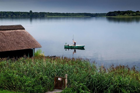 Angler with boat in the Schaalsee