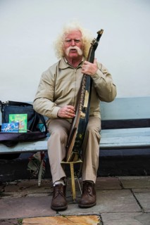 Man playing the traditional Bandura instrument