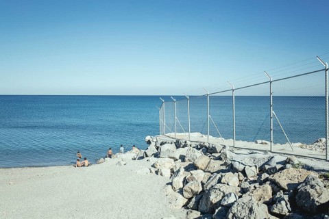 Beach with border fence