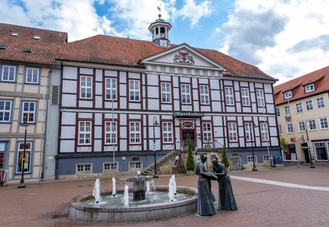Sculpture of two linen weavers at the fountain in front of the town hall in Luechow
